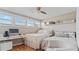 Bright bedroom featuring a queen-size bed and workspace at 1 Loma Linda, Lakeland, FL 33813