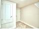 Laundry room with built-in shelving and a utility sink at 1213 Tagliamento Ln, Haines City, FL 33844