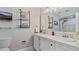 Elegant bathroom with double vanity, marble countertop, and a walk-in shower at 1215 Cypress E Pt, Winter Haven, FL 33884