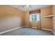 Bedroom with gray carpet and brown window valance at 1215 Cypress E Pt, Winter Haven, FL 33884