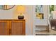 Stylish bedroom detail featuring a wooden cabinet and lamp at 1215 Cypress E Pt, Winter Haven, FL 33884