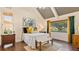 Spacious bedroom with high ceilings, wood floors, and large windows at 1215 Cypress E Pt, Winter Haven, FL 33884