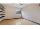 Bedroom with wood floors, a window, and shelving at 1215 Cypress E Pt, Winter Haven, FL 33884