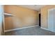 Bedroom with gray carpet, a closet, and a dark door at 1215 Cypress E Pt, Winter Haven, FL 33884