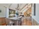 Bright dining room with tile floors, chandelier, and view to backyard at 1215 Cypress E Pt, Winter Haven, FL 33884