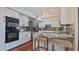 Modern kitchen with granite counters, stainless steel appliances, and breakfast bar at 1215 Cypress E Pt, Winter Haven, FL 33884