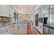 Modern kitchen with granite countertops and stainless steel appliances at 1215 Cypress E Pt, Winter Haven, FL 33884
