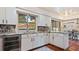Modern kitchen with granite counters, stainless steel appliances, and breakfast bar at 1215 Cypress E Pt, Winter Haven, FL 33884