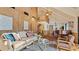 Spacious living room with high ceilings, wood walls and a piano at 1215 Cypress E Pt, Winter Haven, FL 33884