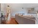 Living room with terracotta tile floors and built-in shelving at 1215 Cypress E Pt, Winter Haven, FL 33884