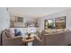 Spacious living room with comfortable sofas and built-in shelving at 1215 Cypress E Pt, Winter Haven, FL 33884