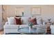 Bright living room features a comfy sofa and a glass coffee table at 1215 Cypress E Pt, Winter Haven, FL 33884