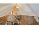 Playful loft area with wood flooring and a teepee at 1215 Cypress E Pt, Winter Haven, FL 33884