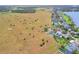 Aerial view of home and neighborhood by lake at 1935 Austin Ter, Winter Haven, FL 33884