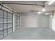 Spacious two-car garage with high ceilings and polished concrete floor at 1935 Austin Ter, Winter Haven, FL 33884