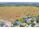 Aerial view of home and neighborhood by lake at 1935 Austin Ter, Winter Haven, FL 33884