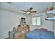 Bedroom with a double bed, ceiling fan, and built-in shelving at 384 Winter Ridge Blvd, Winter Haven, FL 33881