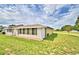 Rear view of condo with screened porch at 384 Winter Ridge Blvd, Winter Haven, FL 33881