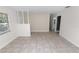 Living room with tile floors and white walls at 5860 E Starling Dr, Mulberry, FL 33860