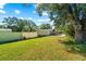 Large backyard with grassy area and privacy fence at 855 Candyce Ave, Lakeland, FL 33815