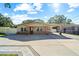 Brick home with a carport and paved driveway at 855 Candyce Ave, Lakeland, FL 33815