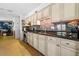 Kitchen with light-colored cabinets and granite countertops at 855 Candyce Ave, Lakeland, FL 33815