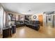 Living room with brown leather couches and a large-screen TV at 855 Candyce Ave, Lakeland, FL 33815