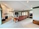 Bright living room with a stone fireplace and comfy seating at 92 Wood Hall Dr, Mulberry, FL 33860
