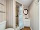 Bathroom with shower, sink, and toilet at 92 Wood Hall Dr, Mulberry, FL 33860