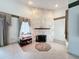 Living room showcasing a fireplace and ample natural light at 92 Wood Hall Dr, Mulberry, FL 33860