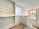 Upper landing with glass shelving and a view from the window at 92 Wood Hall Dr, Mulberry, FL 33860