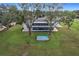 Aerial view showing house, large backyard, and above ground pool at 92 Wood Hall Dr, Mulberry, FL 33860