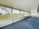 Screened porch boasting a scenic view of the serene backyard at 92 Wood Hall Dr, Mulberry, FL 33860