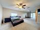 Spacious main bedroom with large windows, ceiling fan, and ample floor space at 92 Wood Hall Dr, Mulberry, FL 33860