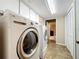 Laundry room with LG washer and dryer, and built-in cabinets at 92 Wood Hall Dr, Mulberry, FL 33860