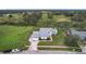 House situated on a spacious lot with green surroundings at 92 Wood Hall Dr, Mulberry, FL 33860