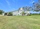 Two-story house with attached garage and landscaped yard at 92 Wood Hall Dr, Mulberry, FL 33860