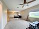 Spacious bedroom with carpeted floors and ample natural light at 92 Wood Hall Dr, Mulberry, FL 33860