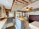 Long wet bar with piano and seating at 92 Wood Hall Dr, Mulberry, FL 33860