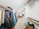 Another walk-in closet with built-in shelving and hanging space at 92 Wood Hall Dr, Mulberry, FL 33860