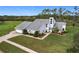 Two-story house with attached garage and green lawn at 92 Wood Hall Dr, Mulberry, FL 33860