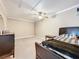 Spacious bedroom with ceiling fan and dresser at 92 Wood Hall Dr, Mulberry, FL 33860