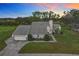 Two-story house with attached garage, set on a spacious lot at 92 Wood Hall Dr, Mulberry, FL 33860