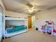 bedroom with a bunk bed and plenty of toy storage at 92 Wood Hall Dr, Mulberry, FL 33860