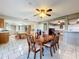 Bright dining room adjacent to kitchen, perfect for entertaining at 92 Wood Hall Dr, Mulberry, FL 33860