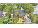 An aerial view showing a single-Gathering home with a spacious backyard and mature trees at 4264 Stafford Dr, Winter Haven, FL 33880
