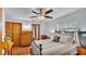 Cozy bedroom with an antique bed and wood floors at 4264 Stafford Dr, Winter Haven, FL 33880