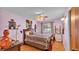 Charming bedroom with cow artwork and wood floors at 4264 Stafford Dr, Winter Haven, FL 33880