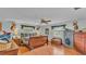 Main bedroom features hardwood floors, a large bed, and ample storage space at 4264 Stafford Dr, Winter Haven, FL 33880