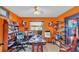 Bright home office with built-in shelving and wood desk at 4264 Stafford Dr, Winter Haven, FL 33880